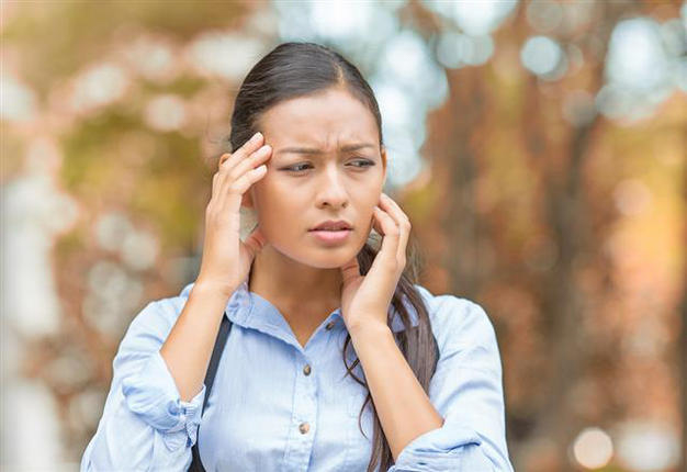 image of anxious woman in the fall