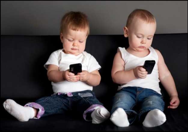 limiting technology two little boys on smart phones