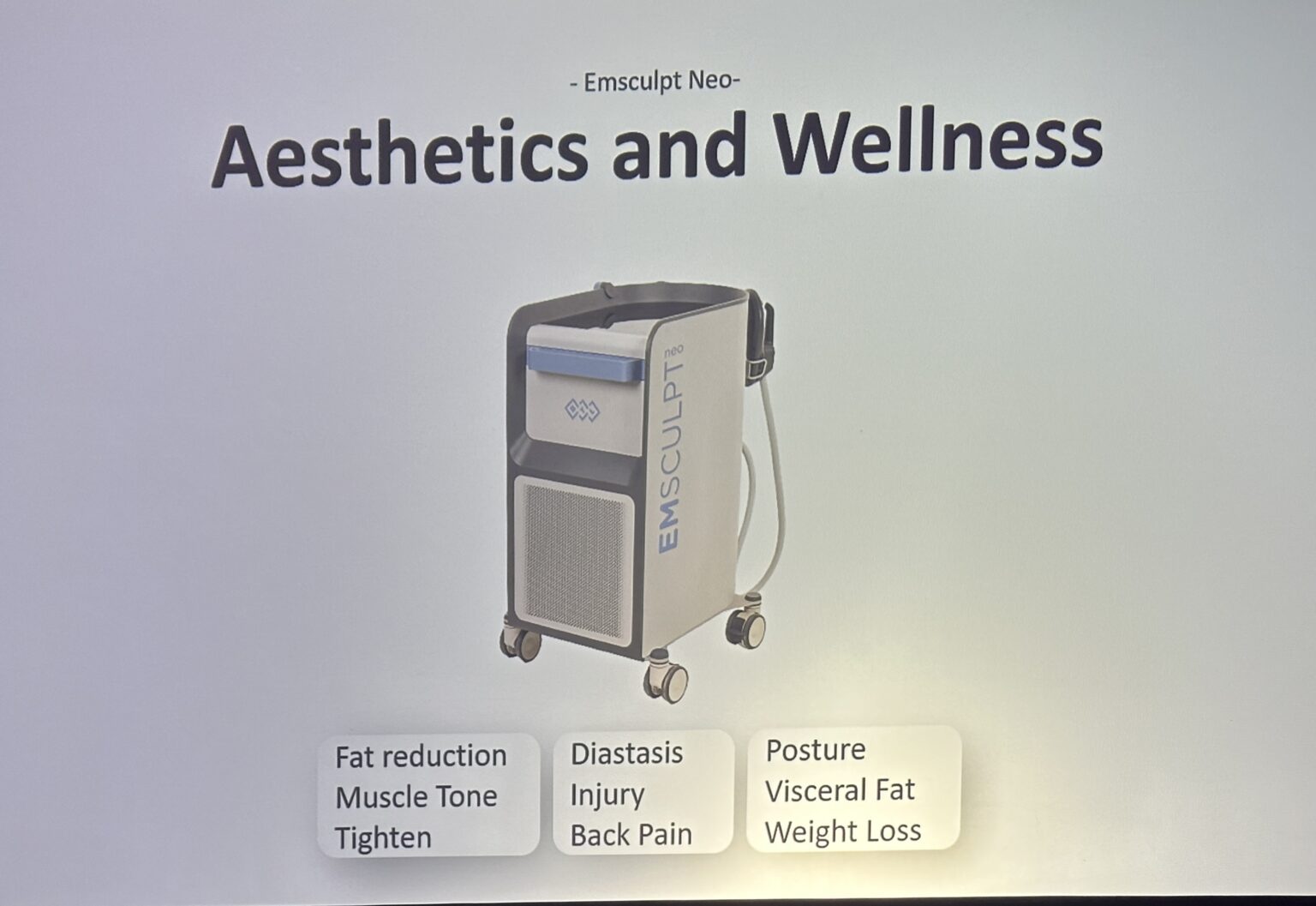 A medical device labeled EMSCULPT NEO on wheels is shown under the heading "Aesthetics and Wellness," with text listing benefits like fat reduction and muscle tone.