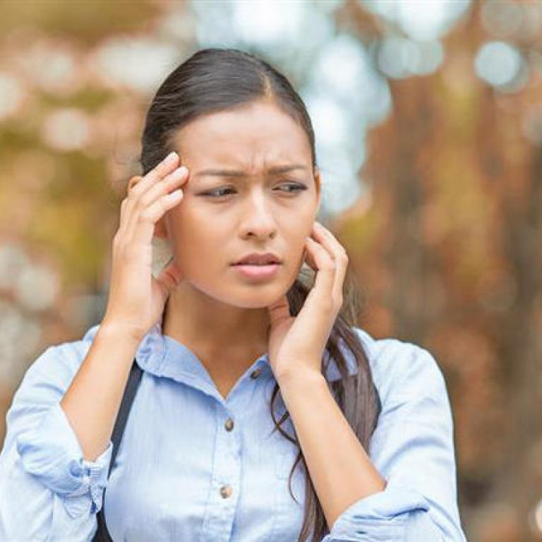 image of anxious woman in the fall